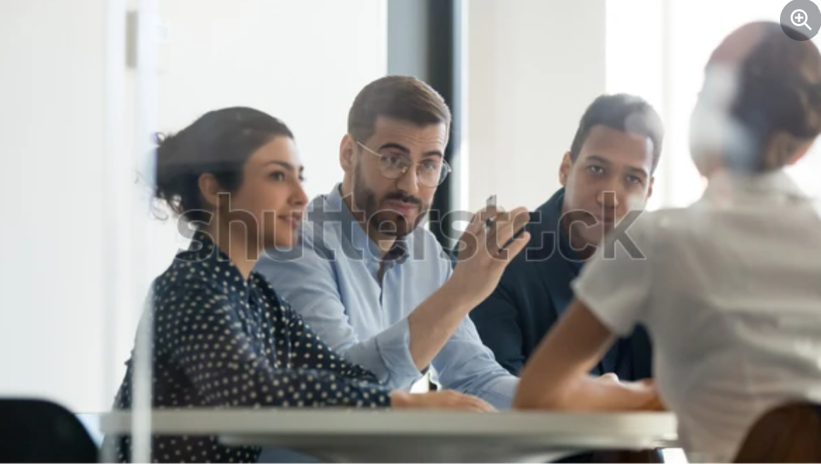 Home buyers meeting with a real estate agent to evaluate negotiation and strategy skills